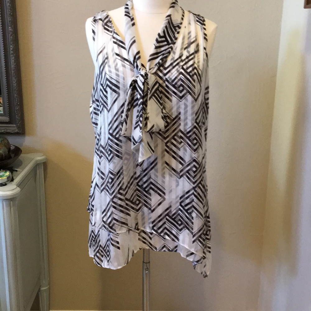 Layered tunic with an asymmetrical hem